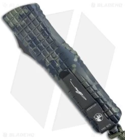 Microtech Combat Troodon OTF Dagger Automatic Knife Olive Camo (3.8" Camo Serr) 8 Microtech Combat Troodon OTF Dagger Automatic Knife Olive Camo (3.8" Camo Serr) -Microtech Shop Microtech Combat Troodon OTF Dagger Auto Olive Camo Camo Serr BHQ 165641 jr side