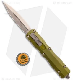 Microtech Dirac Dagger D/E OTF Auto Knife OD Green Alum (2.88" Bronze) 225-13OD -Microtech Shop Microtech Dirac Dagger D E OTF Auto Knife OD Green Alum Bronze 225 13OD BHQ 181096 KC bottle cap