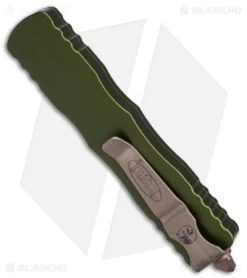 Microtech Dirac Dagger OTF Automatic Knife OD Green (2.88" Bronze Apocalyptic) 8 Microtech Dirac Dagger OTF Automatic Knife OD Green (2.88" Bronze Apocalyptic) -Microtech Shop Microtech Dirac Dagger OTF AK OD Green 2in Bronze Apocalyptic BHQ 174551 td side