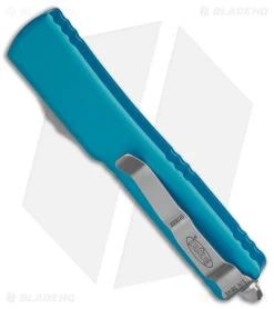 Microtech UTX-70 D/A OTF D/E Automatic Knife Turquoise (Stonewash Full Serr) 8 Microtech UTX-70 D/A OTF D/E Automatic Knife Turquoise (Stonewash Full Serr) -Microtech Shop Microtech UTX 70 DA OTF DE AK Turquoise SW Full Serr BHQ 98282 td side