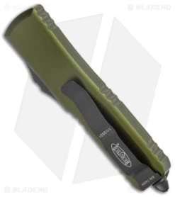 Microtech UTX-85 T/E OTF Automatic Knife OD Green (3.1" Full Serr) 233-3 OD -Microtech Shop Microtech UTX 85 TE OTF Auto OD Green Full Serr 233 3 OD BHQ 139141 jr side